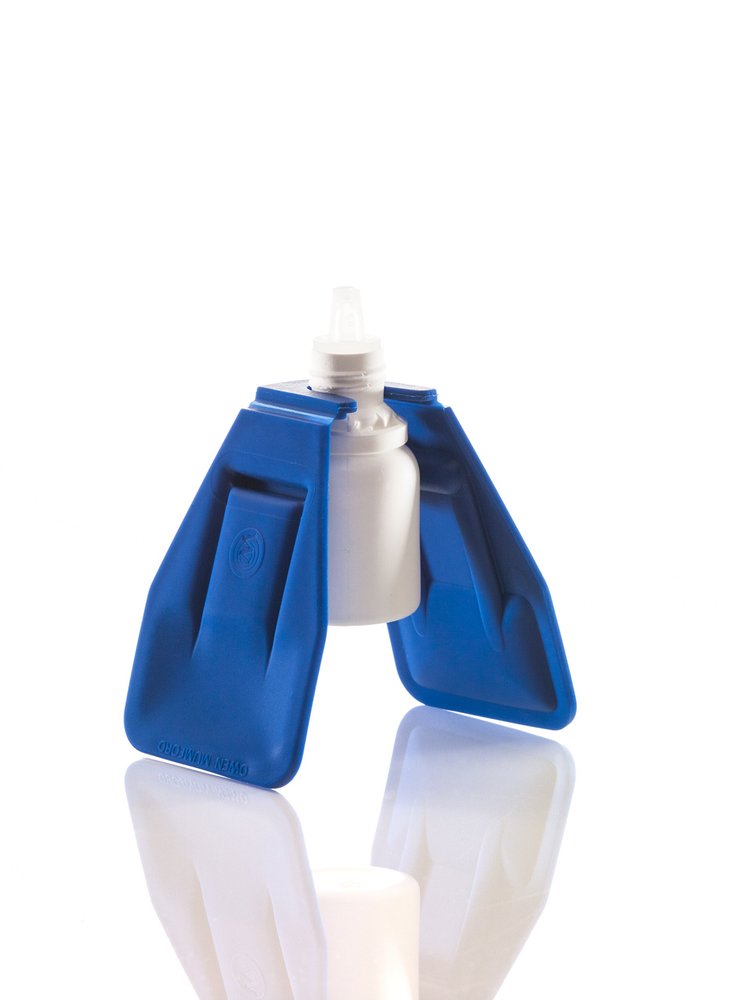 Owen Mumford AutoSqueeze bottle aid clipped around an eye drop bottle