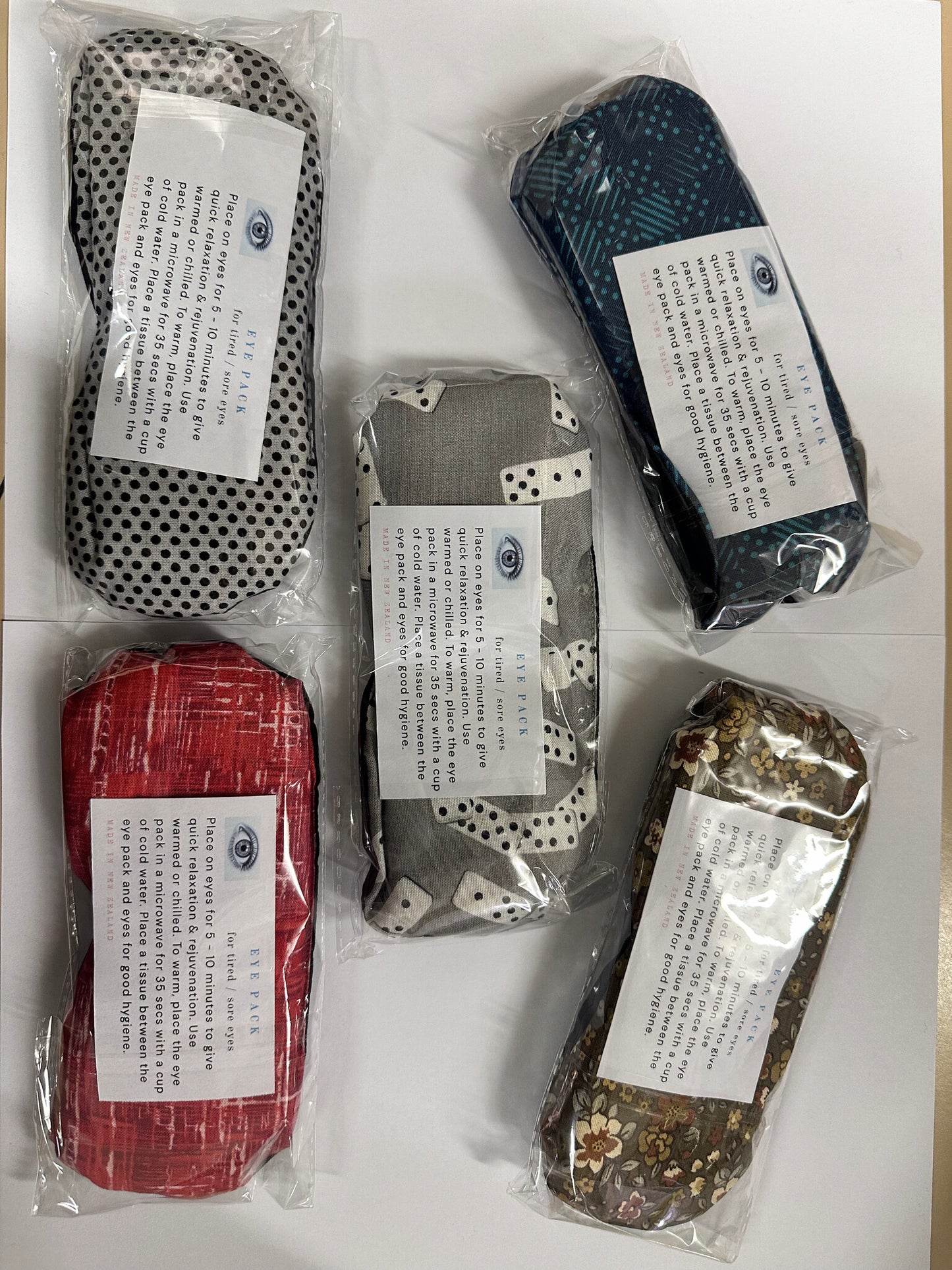 Eye Pack wheat bag warm compresses in assorted fabric prints, sealed packs, made in New Zealand