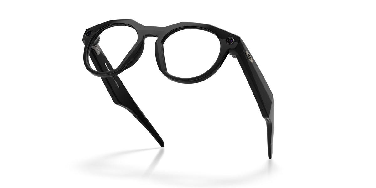 Oakley Meta HSTN Polished Black / Clear to Amethyst Transitions — folded, from behind