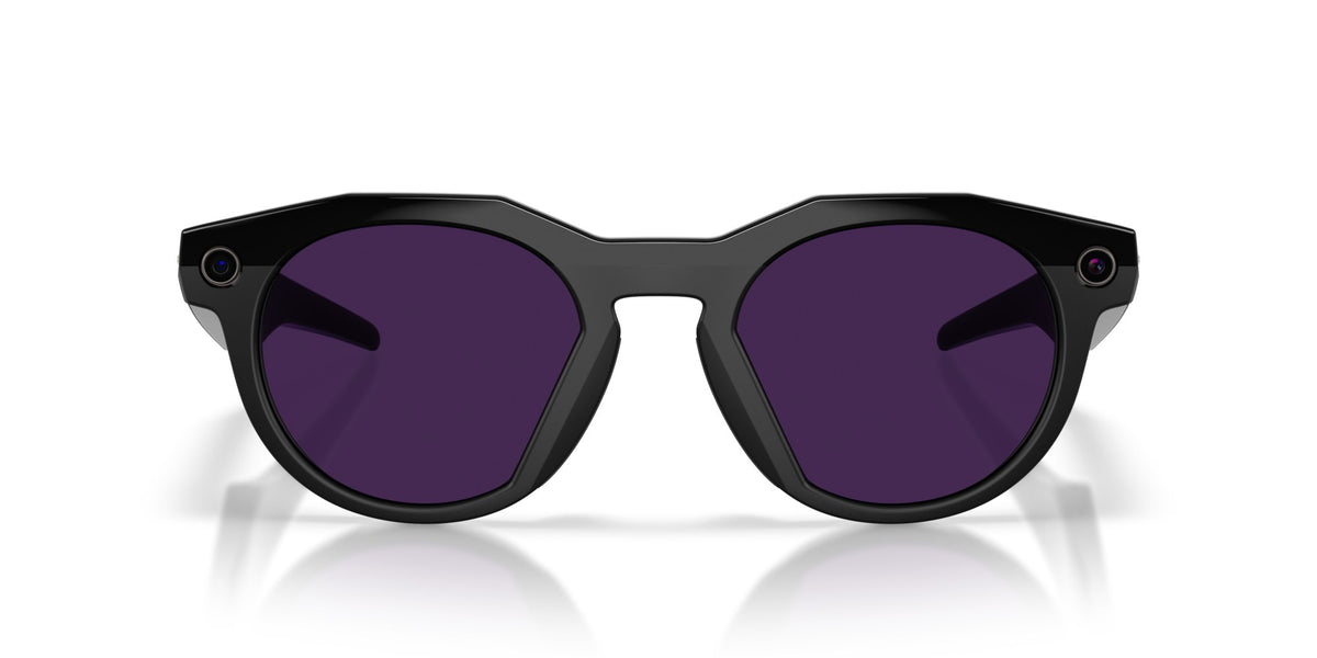 Oakley Meta HSTN Polished Black / Clear to Amethyst Transitions — lenses activated, angled