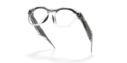 Oakley Meta HSTN Polished Clear / Clear to Grey Transitions — folded, from behind