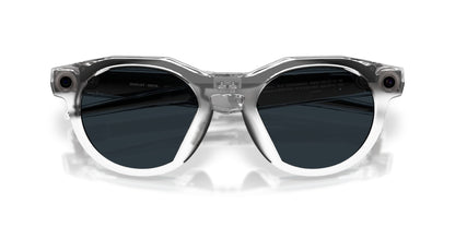 Oakley Meta HSTN Polished Clear / Clear to Grey Transitions — lenses activated, three-quarter