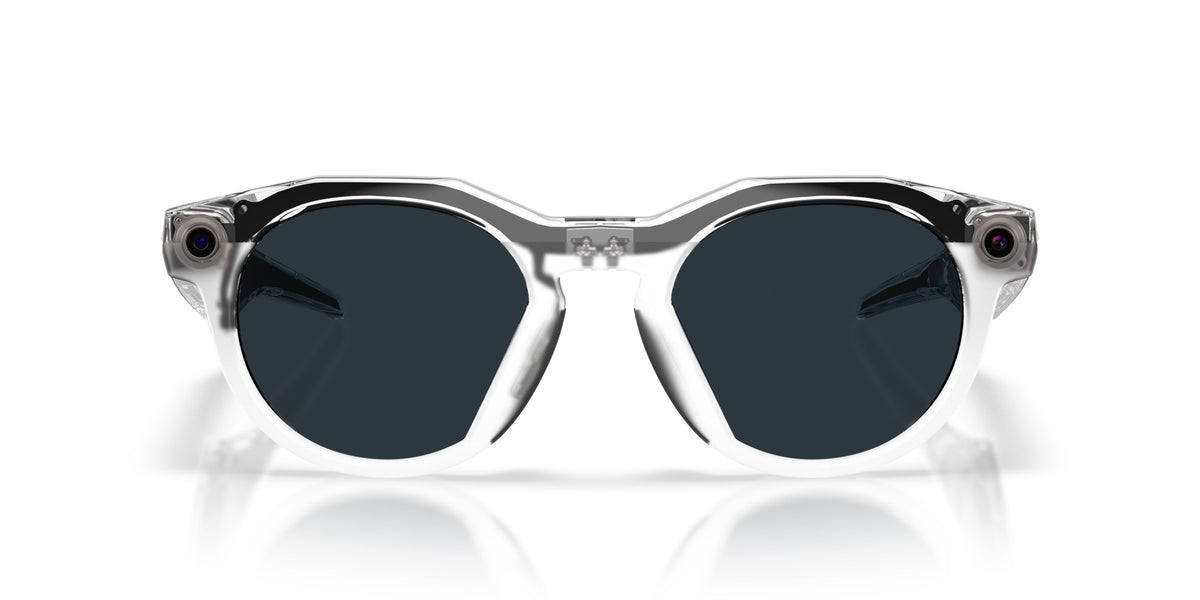 Oakley Meta HSTN Polished Clear / Clear to Grey Transitions — lenses activated, angled
