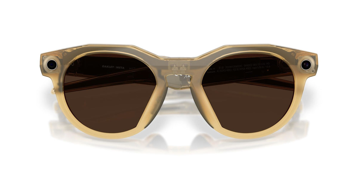 Oakley Meta HSTN Light Curry / Transitions Brown — lenses activated, three-quarter